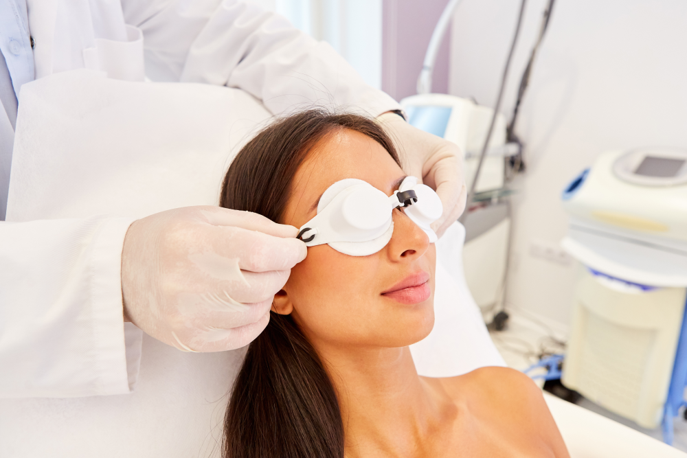 Skin tightening session preparation with protective eye covers.