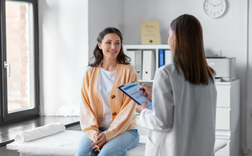 Woman consulting with doctor about hormone replacement therapy.