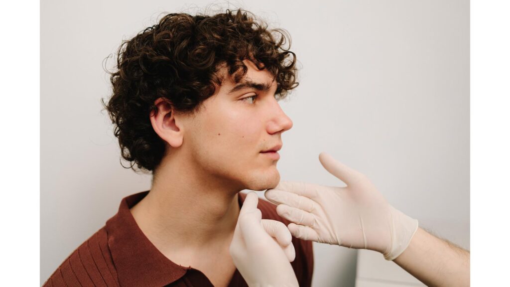 A man receiving a consultation for injectables.